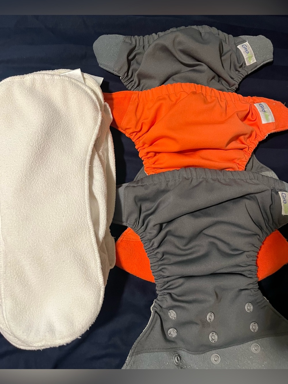 3 Reusable diaper covers & 4 inserts. Grovia.